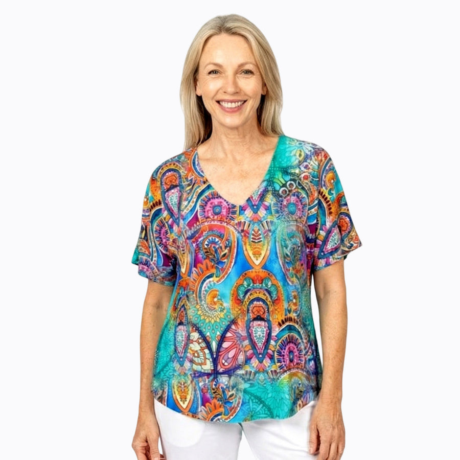 Woman wearing Claire Powell V-Neck T-Shirt in Mosaic print, teal, cobalt and magenta tiles, front view