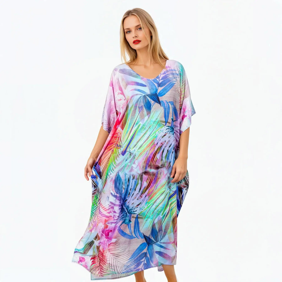 Woman modeling Claire Powell colorful floral kaftan, eco-friendly women's clothing on white background
