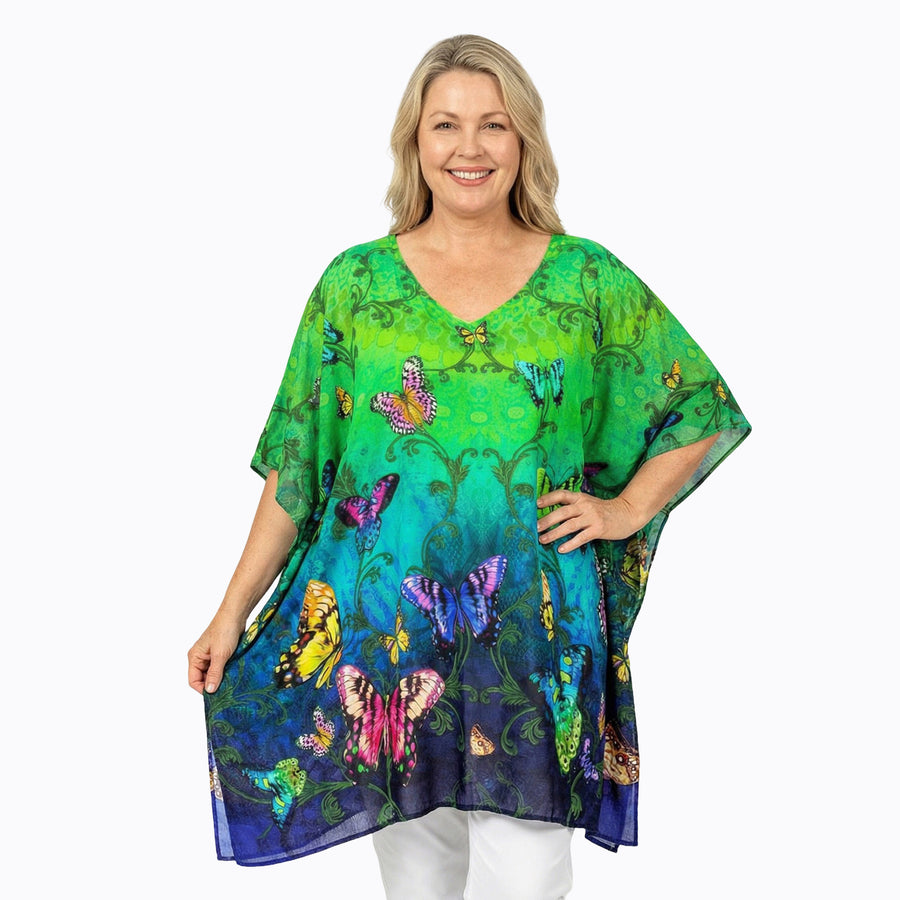 Woman wearing Claire Powell Plus Size Kaftan Top in Flutter print, green and blue butterfly, front view, alternate pose
