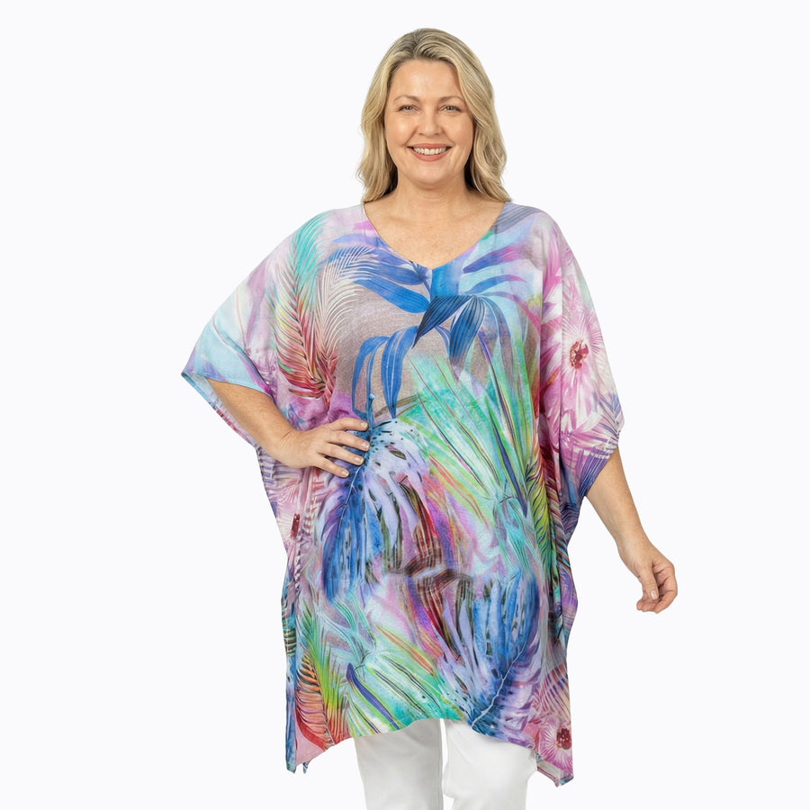 Woman wearing Claire Powell Plus Size Kaftan Top in Oasis print, colourful floral, front view, alternate pose