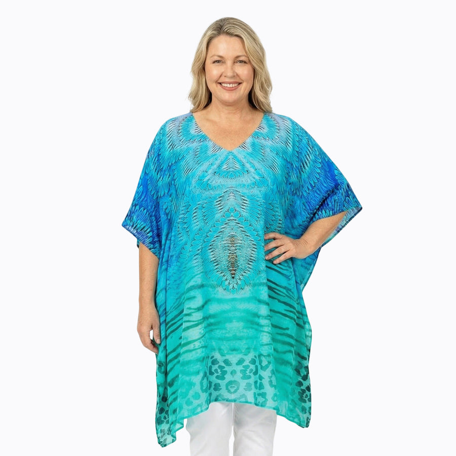 Woman wearing Claire Powell Plus Size Kaftan Top in Spray print, blue and turquoise, front view