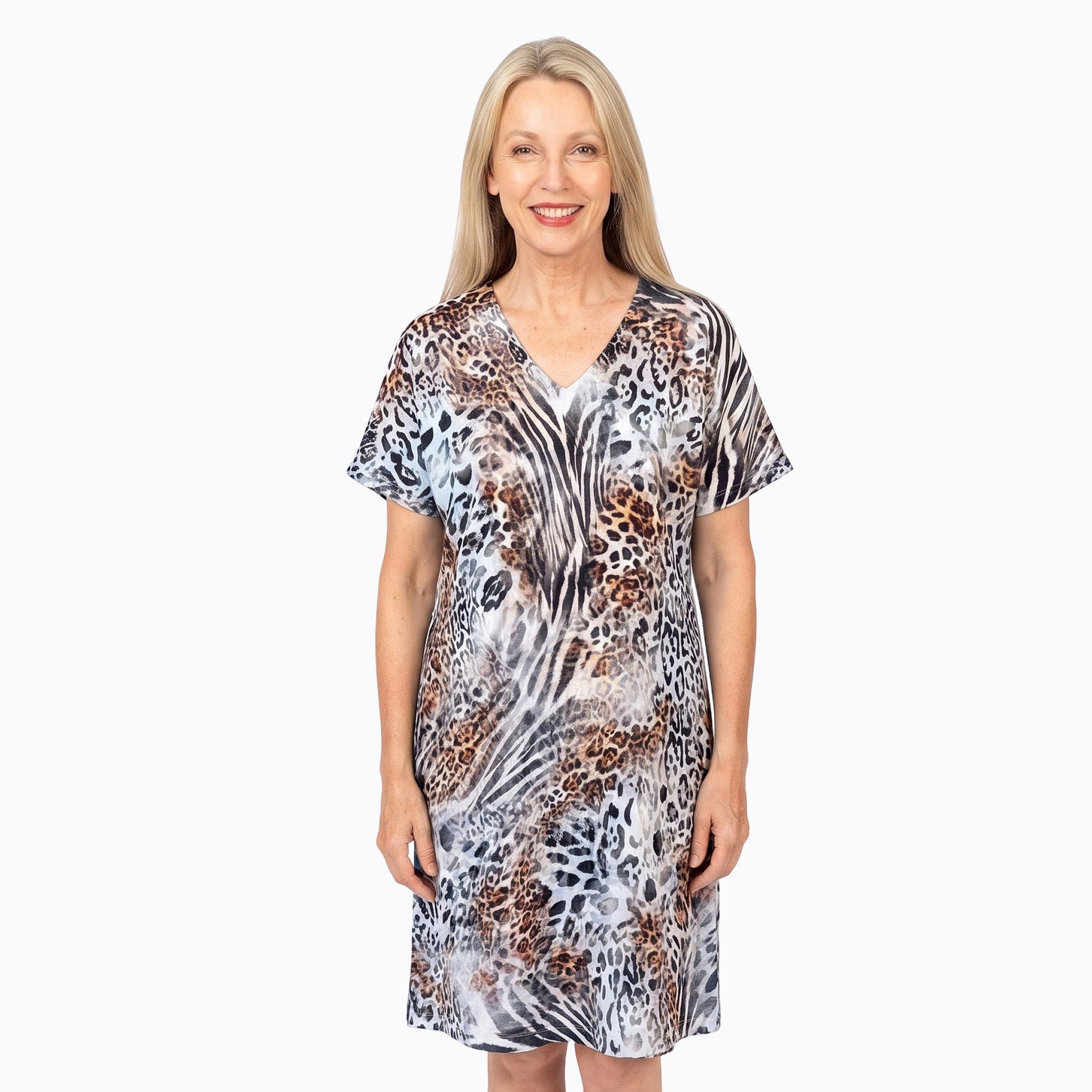Woman wearing Claire Powell Shift Dress in Jungle print, teal, black and brown leopard, front view